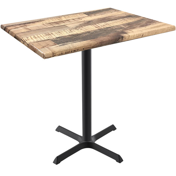 A Holland Bar Stool EnduroTop bar height table with a rustic wood surface and black metal cross base.