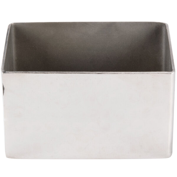 A silver rectangular stainless steel sugar caddy with a hammered texture.
