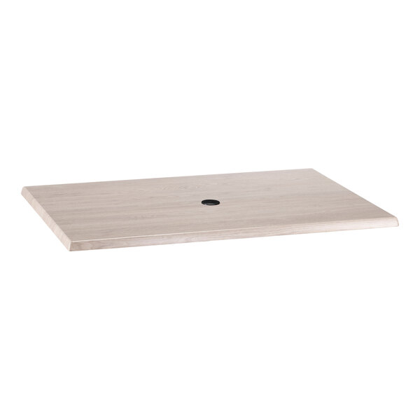 A rectangular white ash laminate table top with an umbrella hole in the center.