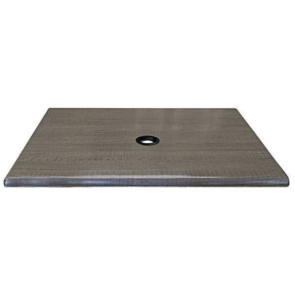 A square charcoal laminate table top with a circular hole in the center.