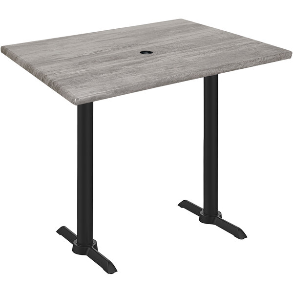 A Holland Bar Stool EnduroTop bar height table with a Greystone wood laminate top and black end column base.