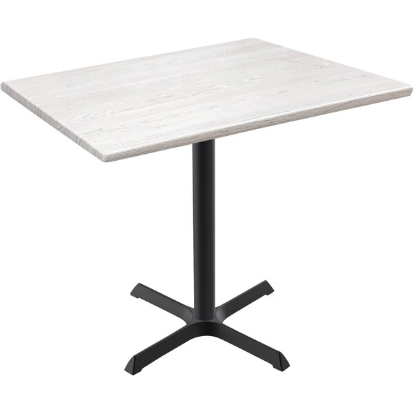 A white Holland Bar Stool EnduroTop table with a black cross base.