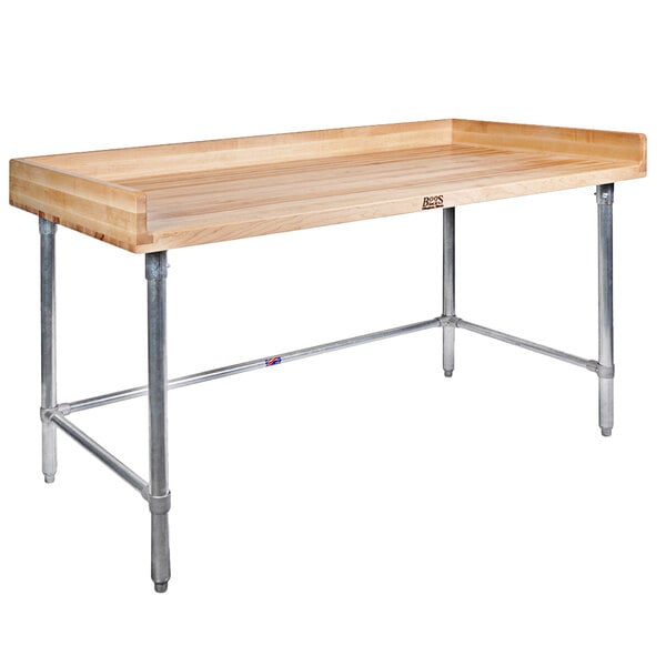 A John Boos wood top table with a galvanized metal base.