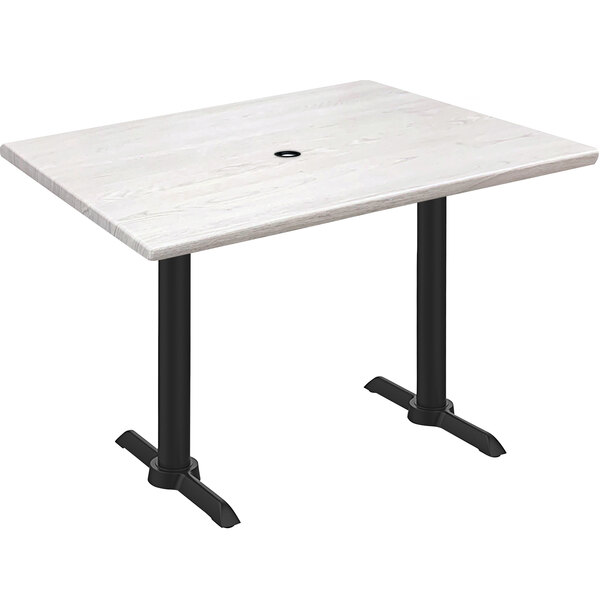 A white Holland Bar Stool EnduroTop table with black end column base.