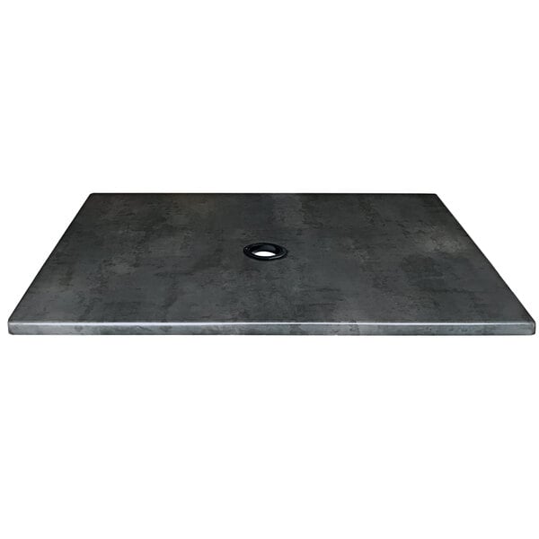 A black square metal table top with a hole in the middle.