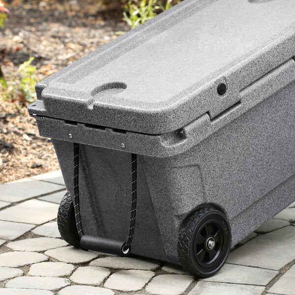 A grey plastic container with wheels.