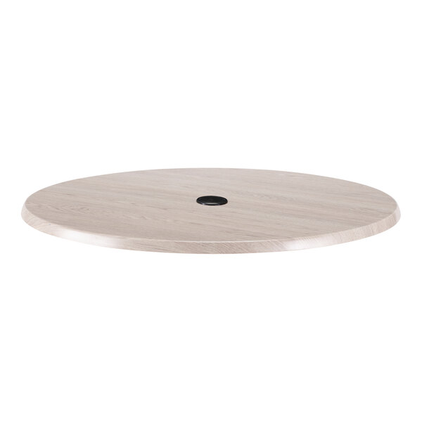 A round white ash laminate table top with an umbrella hole in the center, suitable for outdoor or indoor use.