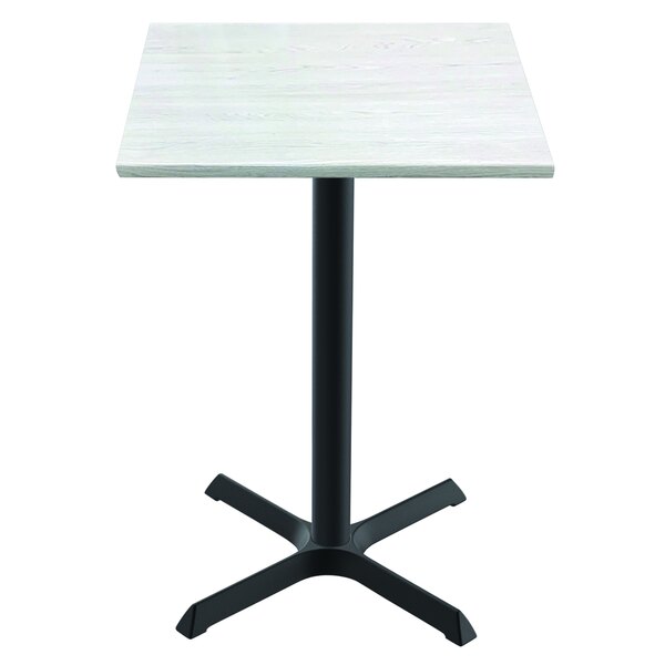 A Holland Bar Stool EnduroTop white ash wood laminate table with a black base.