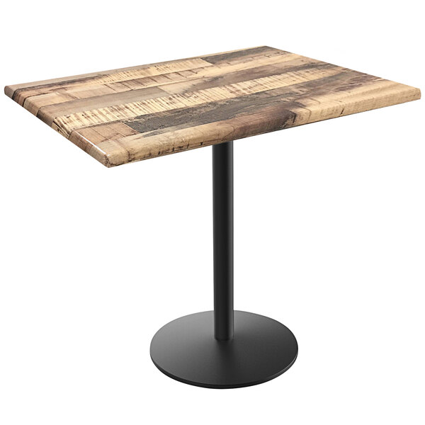 A Holland Bar Stool rustic wood laminate table top on a round black metal base.