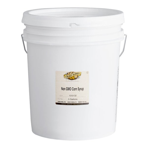 A large white plastic bucket with a handle and a label indicating it contains non-GMO corn syrup.