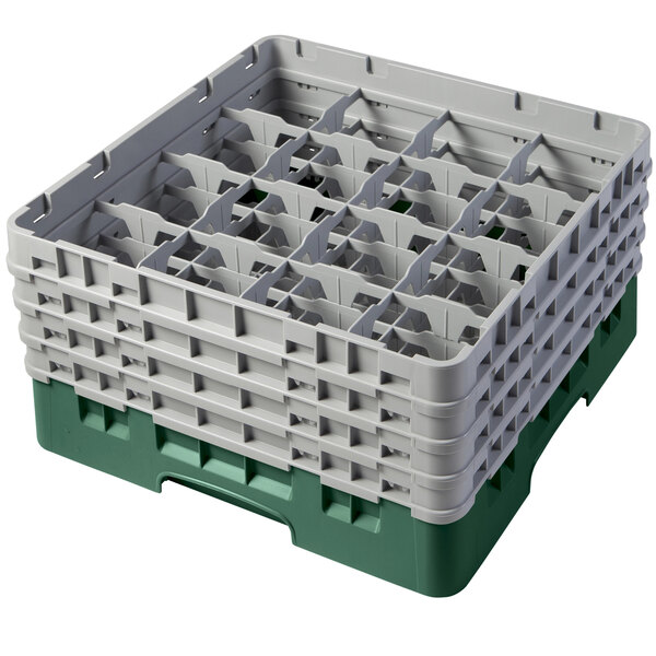 A white and green plastic Cambro glass rack with 16 compartments and 4 extenders.