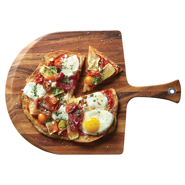 A pizza with eggs and cheese on a wooden pizza peel.