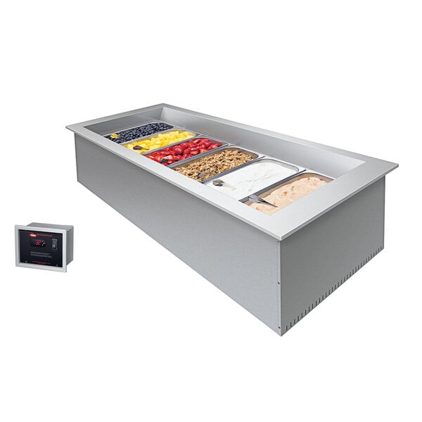 A Hatco drop-in refrigerated cold food well holding a container of food on a counter.