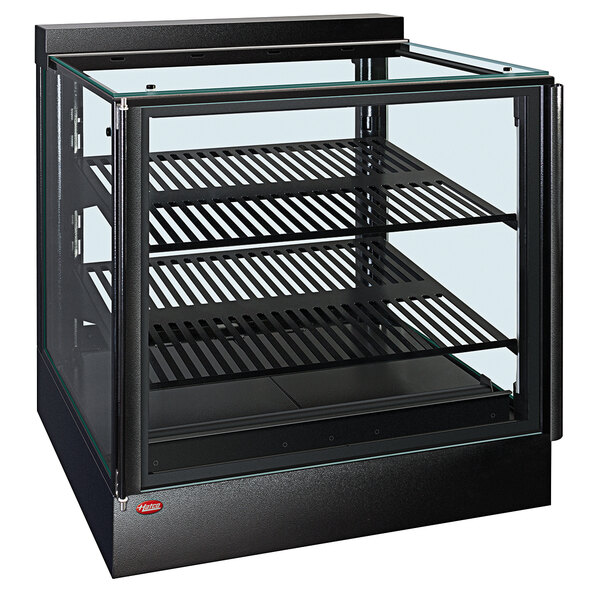 A black glass Hatco countertop heated display warmer with sliding doors.