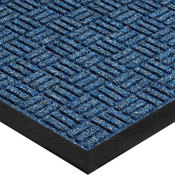 A close up of a navy blue Lavex parquet entrance mat with a black border.