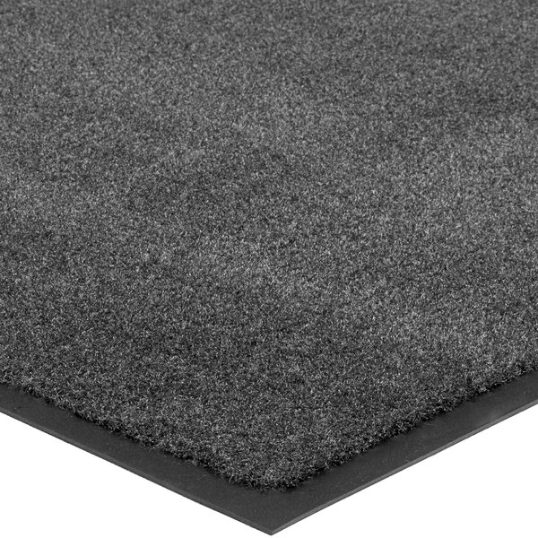 A gray carpet with black trim.