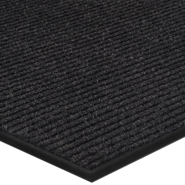 A black Lavex Needle Rib indoor entrance mat with a black stripe.