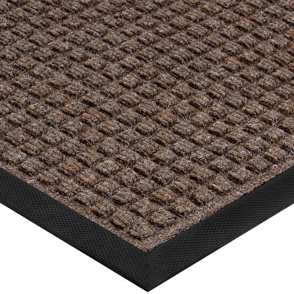A brown Lavex waffle entrance mat with a black border.