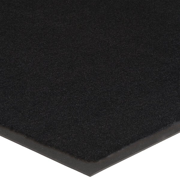 A close up of a black Lavex Olefin entrance mat.