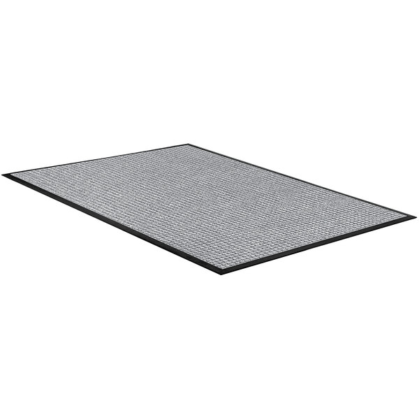 A grey rectangular rug with black border.