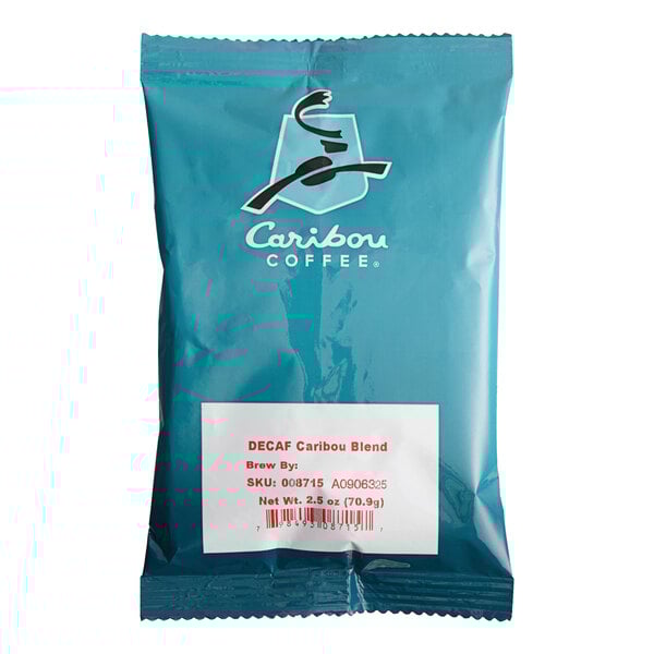 A blue package of Caribou Blend Decaf Coffee with white text.