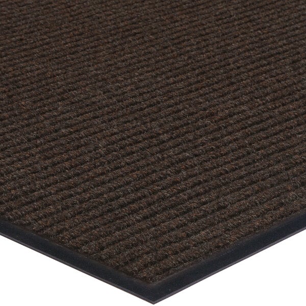 A brown Lavex Needle Rib indoor entrance mat roll with black trim.