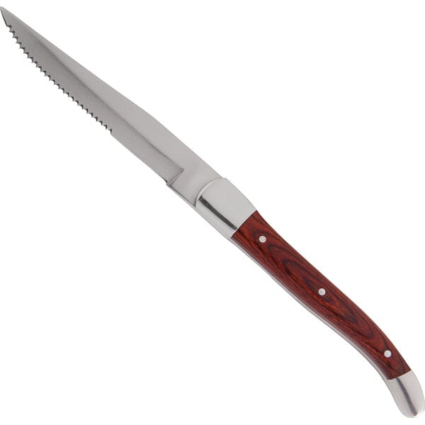 A Fortessa steak knife with a dark wood handle and silver blade.