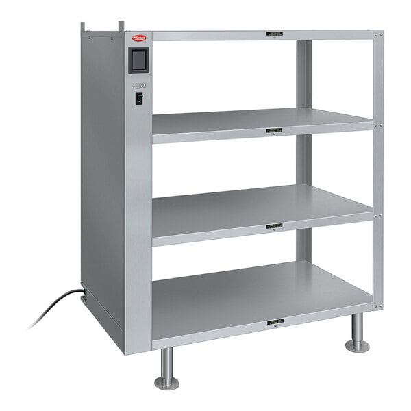 A Hatco Glo-Ray heated metal shelf with three shelves on a counter.