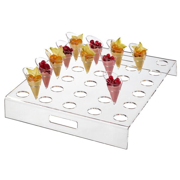 A Solia square clear tray of small fruit cones.