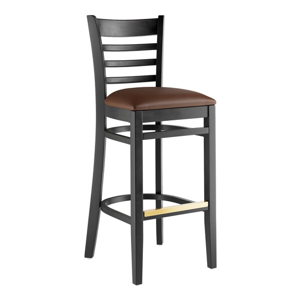 A Lancaster Table & Seating black wood bar stool with dark brown vinyl seat.