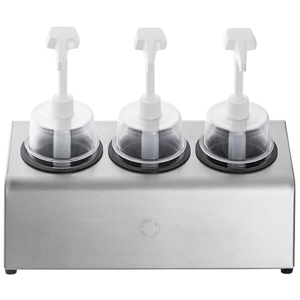 A silver stainless steel Steril-Sil condiment dispenser kit with black pump lids on a counter.