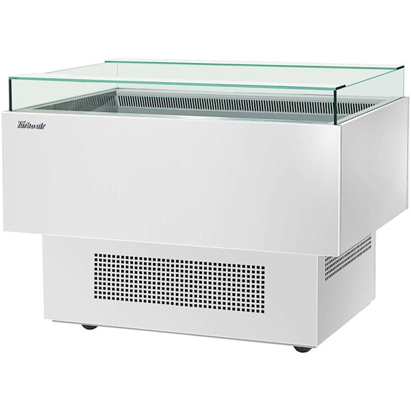 A white rectangular Turbo Air open display merchandiser with a glass top.