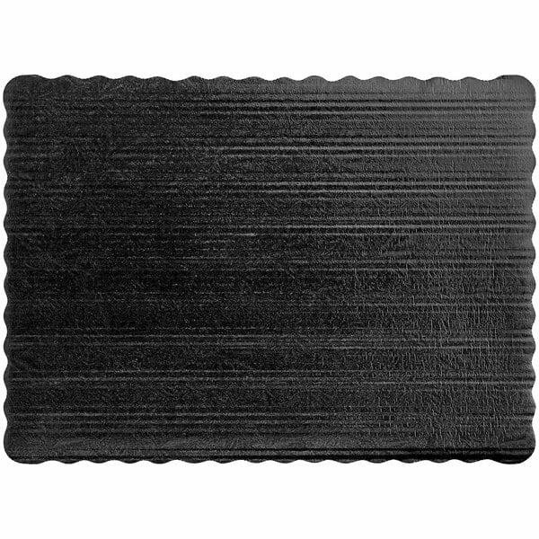 A black rectangular Enjay cake pad with scalloped edges.