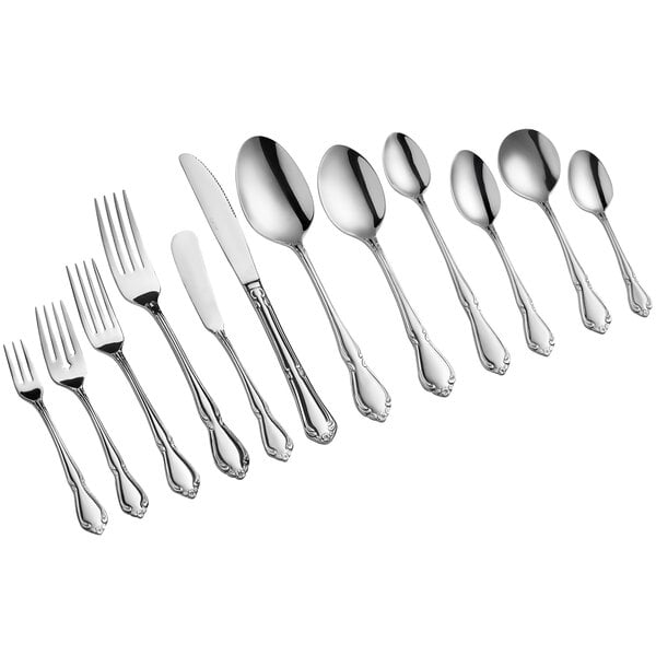 A row of Acopa stainless steel bouillon spoons.