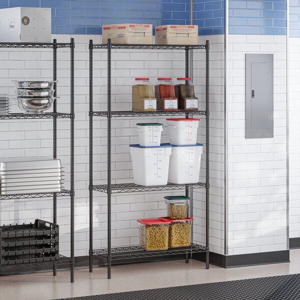 A black epoxy four-shelf storage rack with 72-inch posts, used for organizing kitchen supplies.