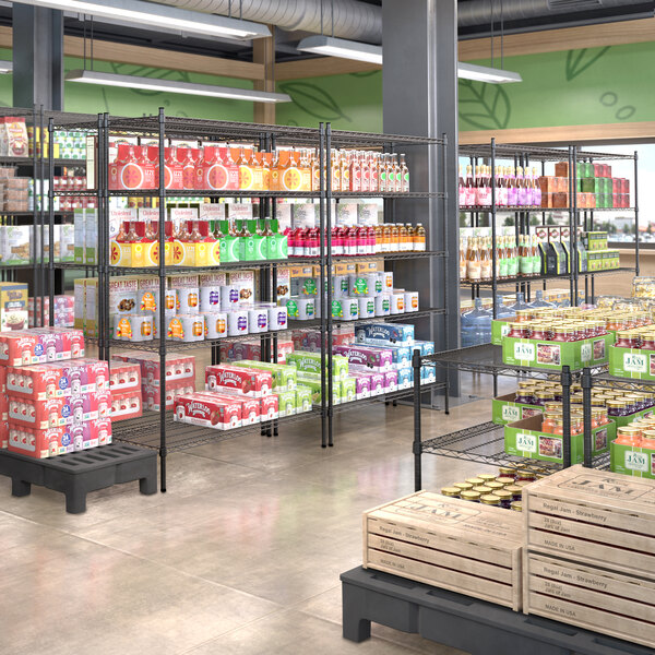 A Steelton black wire shelving kit in a grocery store filled with food.