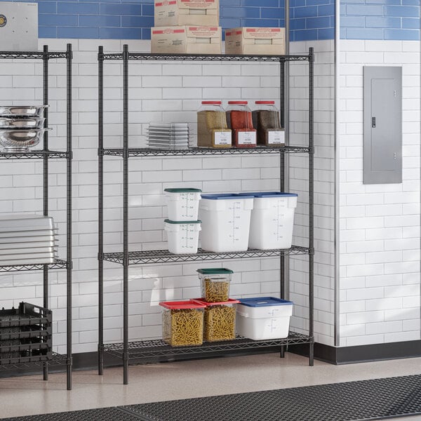 A black epoxy four-shelf storage rack with various food containers and kitchen supplies placed on the shelves.