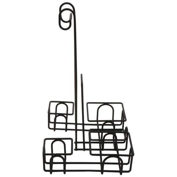A black metal condiment caddy with four baskets.