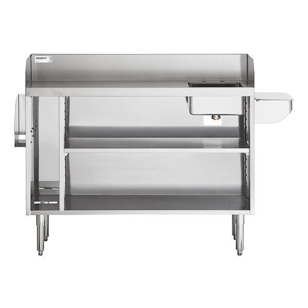 A stainless steel workstation with two shelves, a small sink bowl on the right, a raised back edge, and a side pan holder.