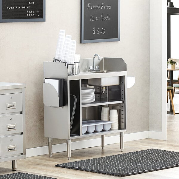 A Regency stainless steel waitress station with a sink and countertop.