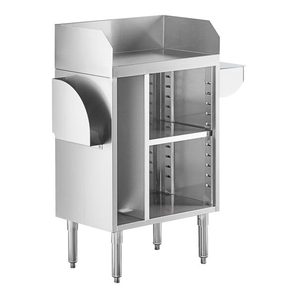A stainless steel station with a raised back and sides, open shelving in the center, and curved holders on each side, supported by four sturdy legs.