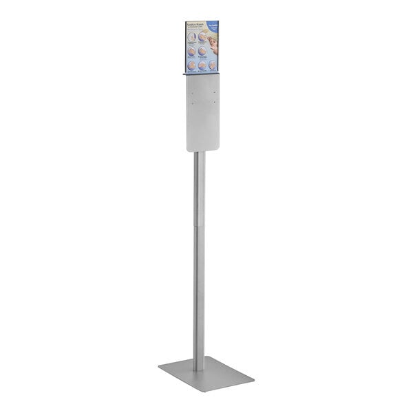 A white rectangular Kutol Health Guard hand sanitizing station with a metal base and a sign on it.