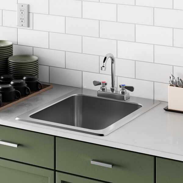 A close up of a Regency stainless steel drop-in sink.