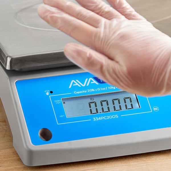 A digital portion control scale with a blue display panel and an oversized stainless steel platform.