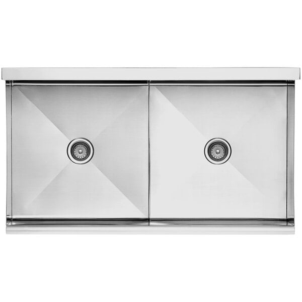 A Regency stainless steel utility sink with two bowls.