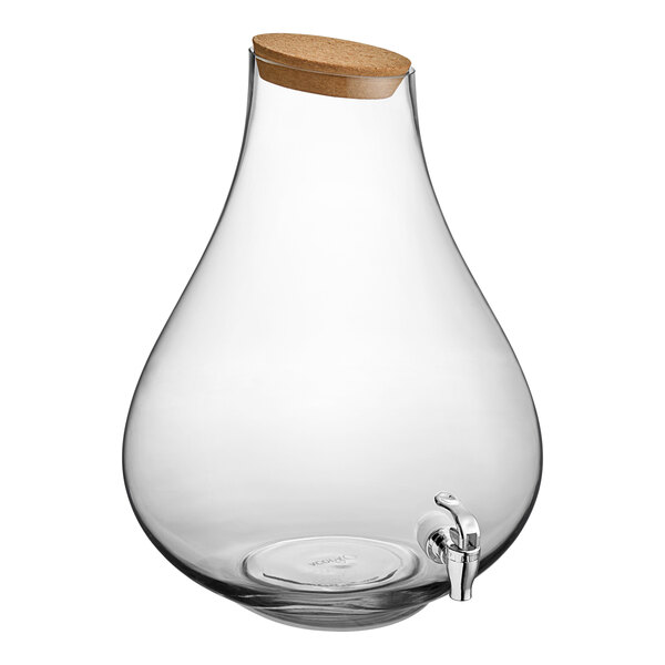 An Acopa clear glass beverage dispenser with a cork lid and metal spigot.