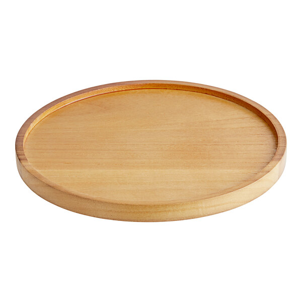 A wood base with a circular edge for an Acopa beverage dispenser on a table.