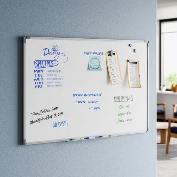 A wall-mounted magnetic whiteboard with an aluminum frame measuring 36 by 24 inches.