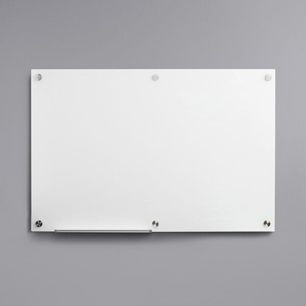 A Dynamic by 360 Office Furniture frameless frosted glass dry erase board on a wall.