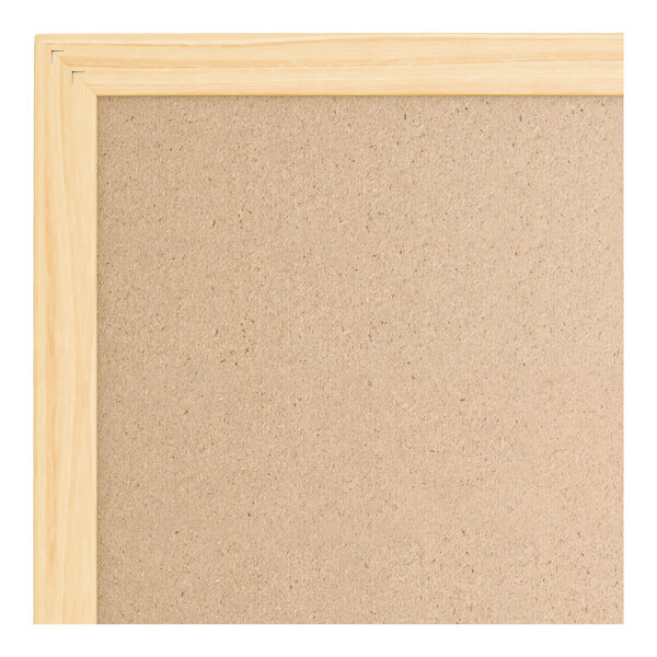 A rectangular cork bulletin board with a light wood frame.